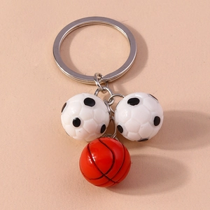 Sports keychain featuring 3D resin soccer balls and basketball on a silver metal ring