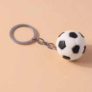 Detailed view of 3D football keychain with classic black and white pentagon pattern
