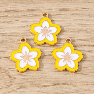 Three sweet cherry blossom flower charms with gold edges and yellow enamel for DIY jewelry