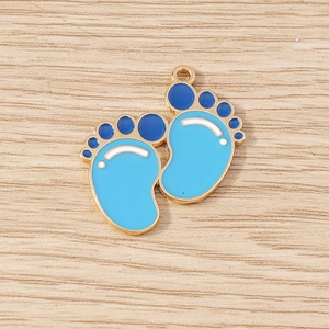 Detail of blue enamel baby footprint charms for DIY necklaces with gold alloy plating