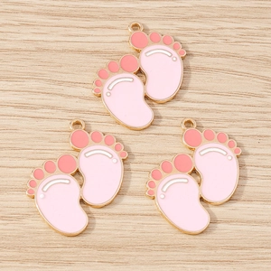 Set of three alloy cartoon footprint pendants with pink enamel for DIY jewelry making