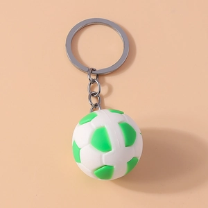 Close-up of a green and white soccer ball keychain with a silver metal ring and chain