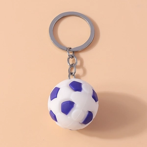 Close-up of a white and purple mini soccer ball keychain with a silver metal ring