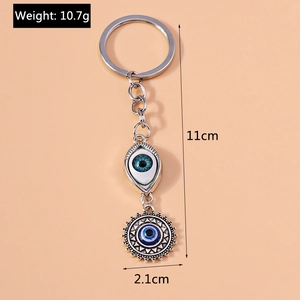 Evil eye keychain with sun pendant and blue pupil detail, total length 11cm and weight 10.7g