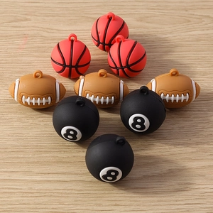 Detailed close-up of resin sports ball pendants including basketball, football and pool 8-ball