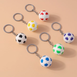 Close-up of soccer ball keychains in six colors with metallic silver rings and chains