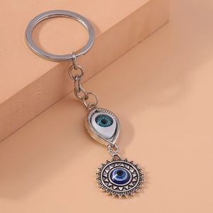 Evil Eye and Sun keychain with retro silver metal and blue resin charms for backpacks
