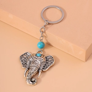 Vintage elephant keychain with turquoise beads and engraved silver alloy textures
