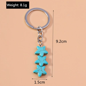 Detail view of turquoise star keychain with dimensions 9.2cm and weight 8.1g for bags