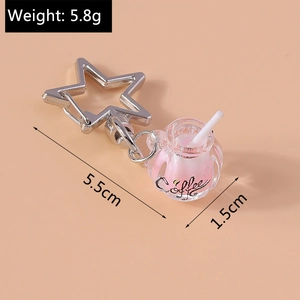 Detailed view of glow-in-the-dark coffee cup keychain measuring 5.5cm and weighing 5.8g