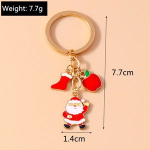 Detailed view of Christmas Santa keychain with enamel charms and size specifications