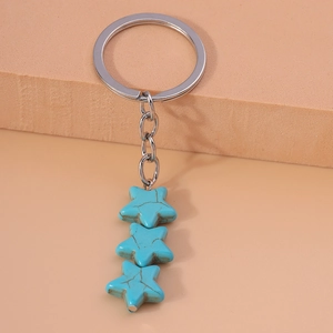 Minimalist turquoise star keychain with three stones for handbags and accessory styling
