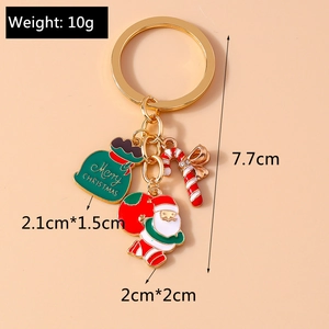 Close-up of Christmas keychain with Santa Claus, candy cane and gift bag charms