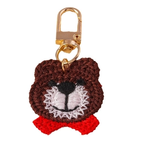 Handmade brown crochet bear keychain with red bow and golden metal lobster clasp