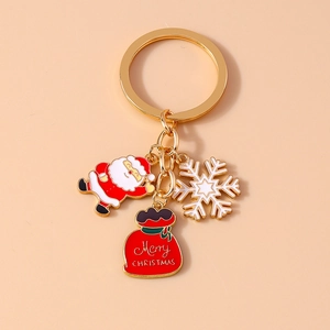 Christmas keychain set with Santa Claus, snowflake and Merry Christmas gift bag charms