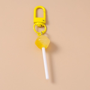 Detailed view of creative yellow lollipop keychain with translucent resin head and metal clasp