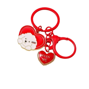 Red heart keychain with cute white puppy dog illustration and golden Kiss Me pendant