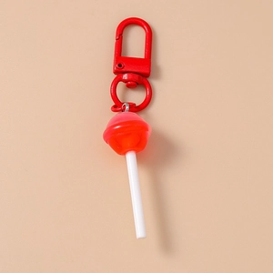 Detail of red lollipop keychain featuring a coordinated red metal lobster clasp