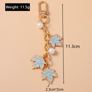 Detailed size parameters of the gold maple leaf and pearl keychain with gray-blue leaves