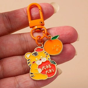 Porte-clés mignon tigre et orange avec message de chance sur mousqueton orange
