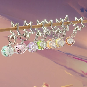Set of creative luminous coffee cup keychains with star-shaped clips in various colors