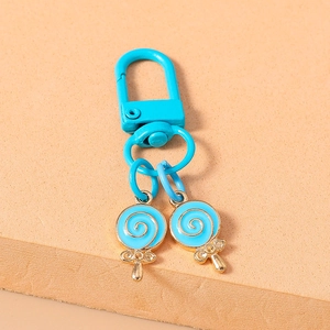 Close-up of sky blue lollipop charms keychain with high-quality alloy drip oil finish
