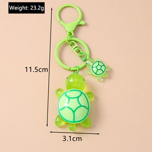 Detail of cute turtle keychain dimensions with green resin pendants and metal ring