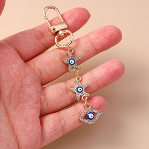 Trend Evil Eye keychain with gold starfish and sparkling rhinestones on palm pendant