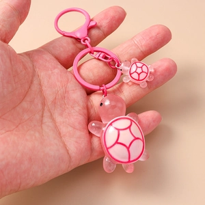 Pink resin turtle keychain set with large and small pendants on a pink metal clip