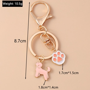 Détails des breloques chiot et patte en émail rose avec dimensions sur anneau en or rose