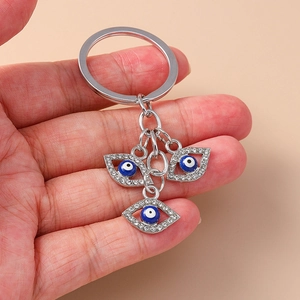 Funkelnder Evil Eye Schlüsselanhänger mit blauen Kristallanhängern und silbernem Schlüsselring