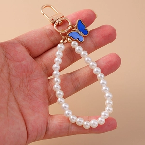 Portachiavi alla moda con perle e ciondolo a farfalla in smalto blu scuro con anello d'oro