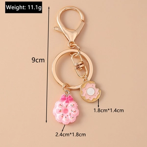 Detailed view of the cute pink donut and cookie charms with exact size measurements