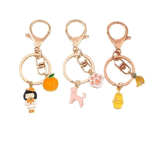 Set de porte-clés chien et orange en alliage or rose avec breloques émaillées