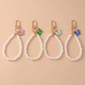 Set di portachiavi con farfalla e perle in quattro colori con chiusura in metallo dorato