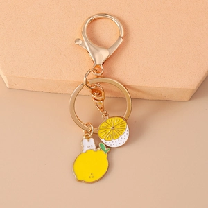 Detailed macro view of creative lemon keychain with rabbit ears and translucent slice
