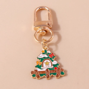 Christmas tree keychain with gold lobster clasp and festive colorful enamel pendant charm