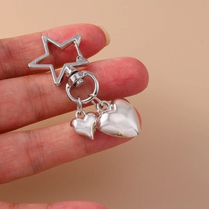 Silver polished heart keychain with star-shaped carabiner clasp and heart-shaped pendants