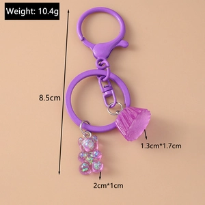 Detailed view of purple resin glitter bear and cupcake keychain with dimensions