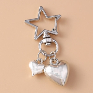 Detail view of starfish shell keychain with heart charms and star-shaped lobster clasp