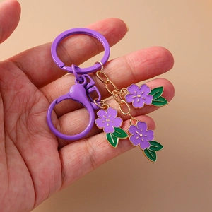Sweet purple cherry blossom keychain with gold-edged flower charms and spring clasp