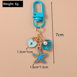 Blue heart lock keychain with seashell, pearl and starfish charms, 7cm total length
