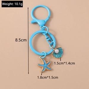 Detail of blue starfish and shell keychain with pearl accent and precise dimensions