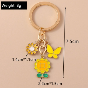 Vue détaillée du porte-clés avec breloques de tournesol et papillon avec dimensions
