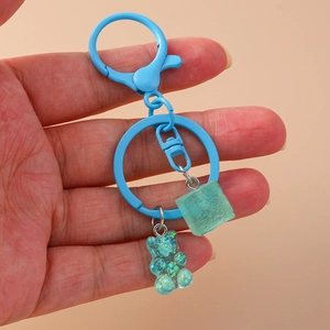 Cartoon blue resin bear keychain with glitter filling and frosted sugar cube pendant