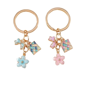 Set di portachiavi con fiocco e fiori di ciliegio nei colori rosa e azzurro chiaro