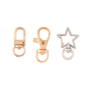 Assorted alloy lobster clasps and star-shaped key rings in rose gold and silver finish