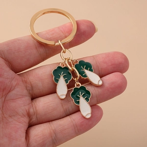 Porte-clés créatif avec pendentifs choux en émail et finition métal doré