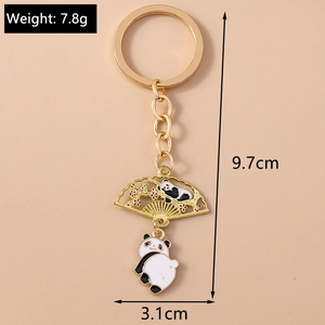 Detail view of panda and plum blossom metal keychain with 9.7cm length and 7.8g weight