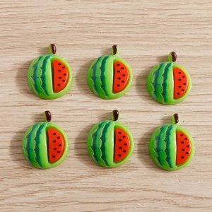Macro view of six miniature resin watermelon slices for DIY phone case crafts